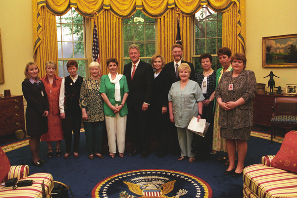 Photo of President Bill Clinton meeting some of the ICLVR families